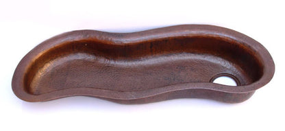 Wavy trough copper sink.