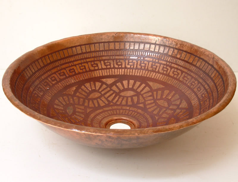 16-inch round hammered copper drop-in bathroom sink with hand-etched oxidized tribal print and natural copper finish.